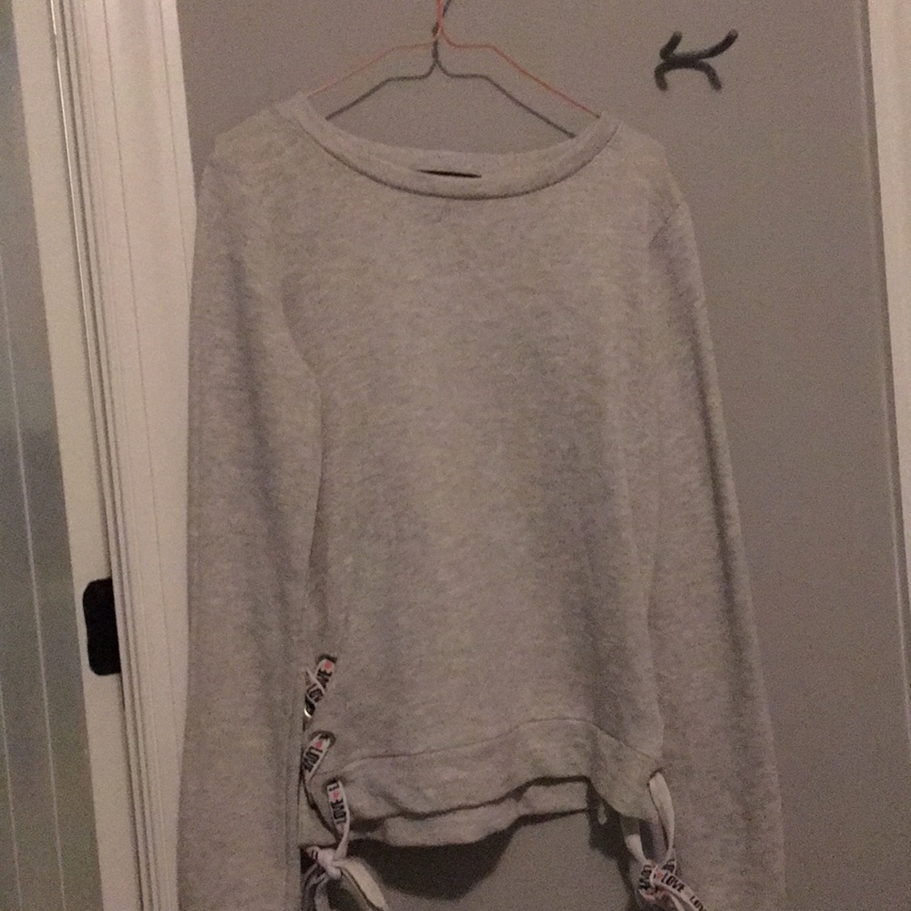 White sweatshirt with detailing on the side